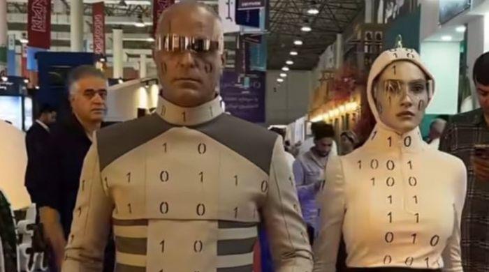 Iran tech expo's advanced humanoid robots' exposed as performers in costumes