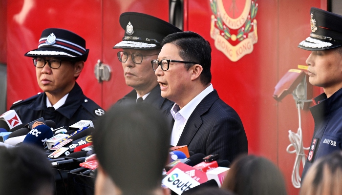 Chris Tang, Secretary for Security of Hong Kong, speaks to the media at the site in the aftermath of a major fire that swept through several apartment blocks at the Wang Fuk Court residential estate in Hong Kongs Tai Po district on November 28, 2025. — AFP