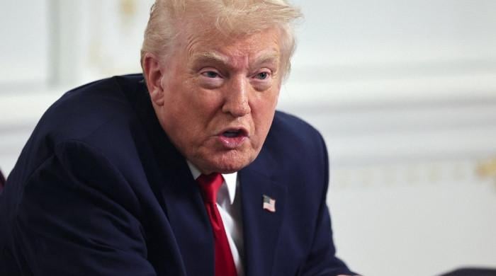 Trump blames immigration failures after Washington shooting