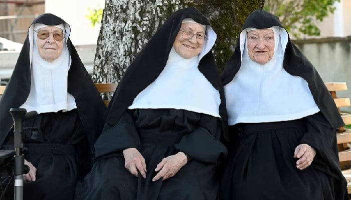Nuns Regina, 86, Rita, 81, and Bernadette, 88, pose for a photo in this undated picture. — Reuters/File
