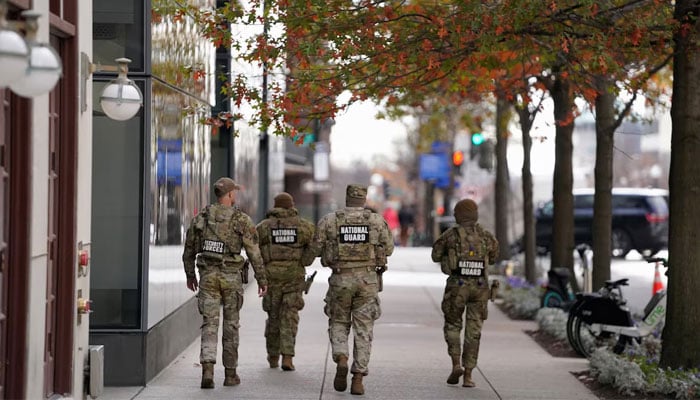 Members of the National Guard walk near the site where two National Guard members were shot, near the White House, in Washington, DC, US, November 28, 2025. — Reuters