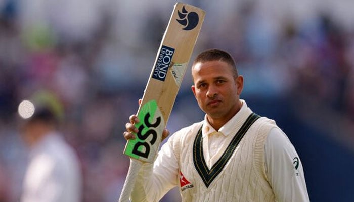 Australias Usman Khawaja acknowledges the crowd as he walks off the field at stumps after scoring 126 runs not out on June 17, 2023. — Reuters