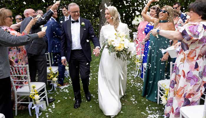 Australian Prime Minister Anthony Albanese (Left) and his new wife Jodie Haydon walk together during their wedding ceremony in Canberra on November 29, 2025. — AFP