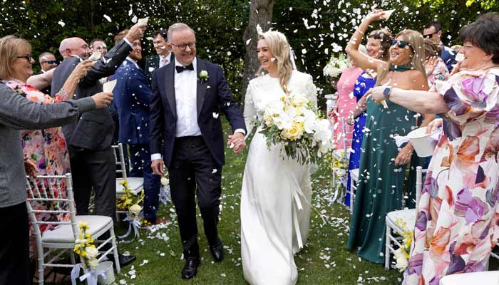 Australian Prime Minister Anthony Albanese (L) and his new wife Jodie Haydon walk together during their wedding ceremony in Canberra on November 29, 2025.— AFP