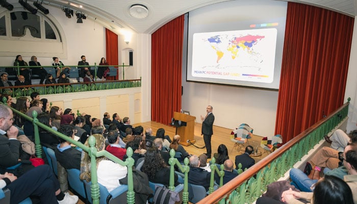 Professor Asim Ijaz Khwaja speaks to Oxford University students at Lady Margaret Hall. — reporter/File