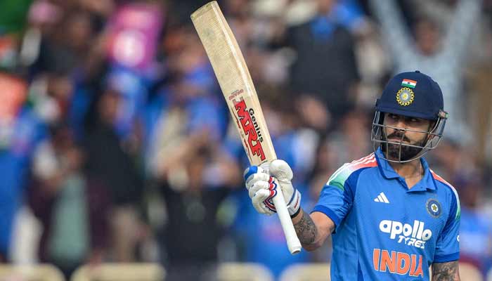 Indias Virat Kohli celebrates after scoring a half-century (50 runs) during the first one-day international (ODI) cricket match between India and South Africa at the JSCA International Stadium in Ranchi on November 30, 2025.— AFP
