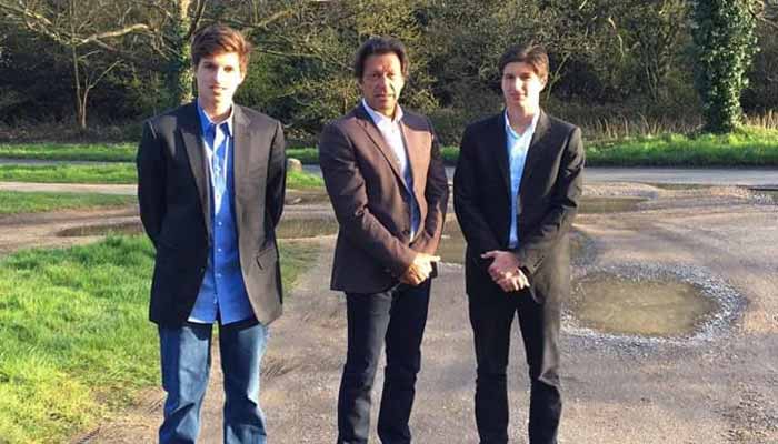 Pakistan Tehreek-e-Insaf founder Imran Khan (centre) poses with his sons Sulaiman Khan (left) and Kasim Khan. — X/@PTIofficial