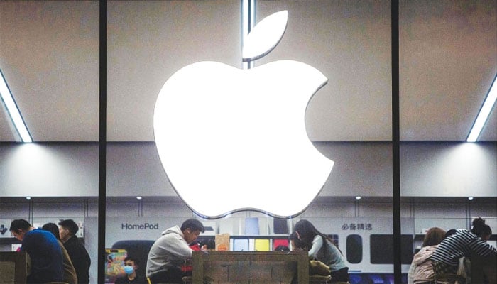 Customers visit an Apple store in Shenyang, a city in China’s north-eastern Liaoning province, in this file photo. — AFP
