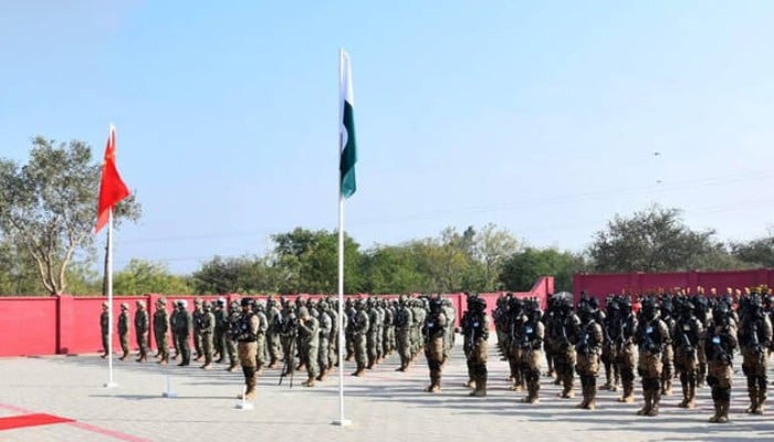 This image shows Pakistan Army and People’s Liberation Army (PLA) of China soldiers attending the opening ceremony of joint military exercise Warrior-IX at the National Counter Terrorism Centre (NCTC), Pabbi, in Nowshera. — ISPR