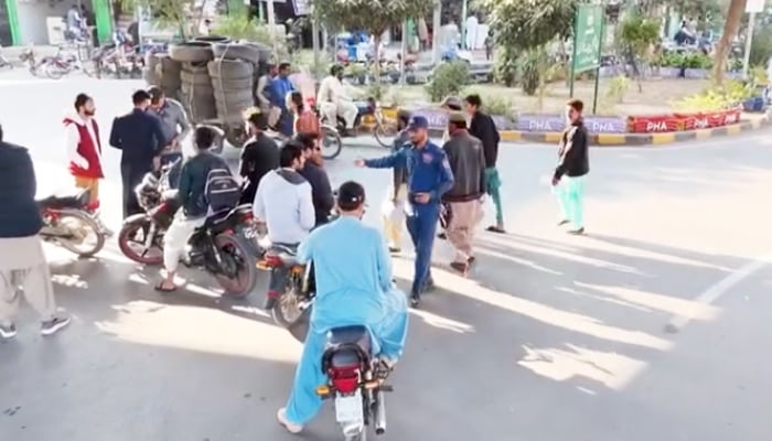 Police stop bikers during routine checks in Multan. — Facebook@TrafficMultan