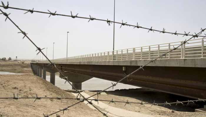 A view of a bridge to Afghanistan across Panj river in Panji Poyon border outpost, south of Dushanbe, Tajikistan, May 31, 2008. — Reuters