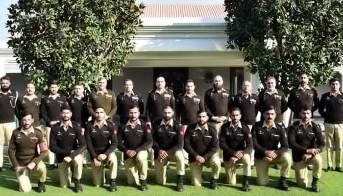 Chief of Army Staff (COAS) Field Marshal Syed Asim Munir poses for a group photo with participants of the Cambrian Patrol competition at the General Headquarters (GHQ) in Rawalpindi on December 2, 2025. — ISPR