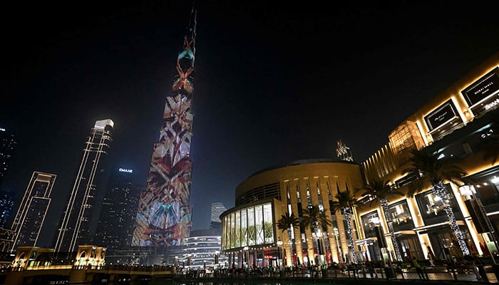 A colourful laser show lights up the Burj Khalifa, the worlds tallest building, in Dubai on September 23, 2025. — AFP