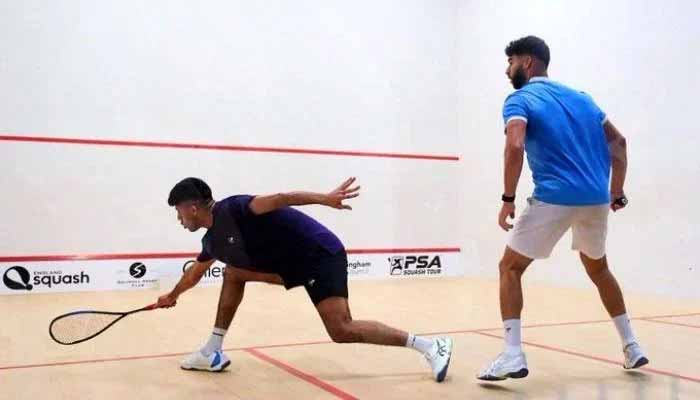 Pakistans Noor Zaman (left) can be seen in action during the qualifying round of the British Open Squash Championship against Egypts Kareem El Torkey in this undated image. — Reporter