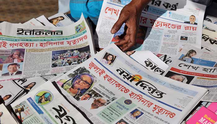 A vendor sells newspapers with headlines about the news of the ousted PM Sheikh Hasinas death sentence on charges of crimes against humanity for ordering a deadly crackdown on a student-led uprising last year, in Dhaka, Bangladesh, November 18, 2025. — Reuters
