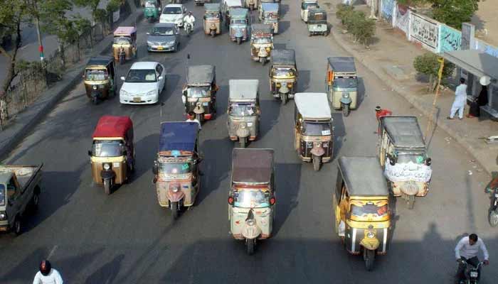 Four-seater rickshaws are pictured at a busy road in Karachi. — PPI/File