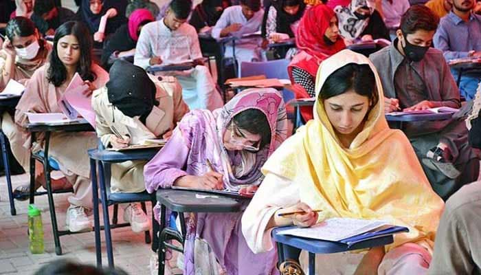 Students are solving their question papers during pre-entry test in Hyderabad. — APP/File