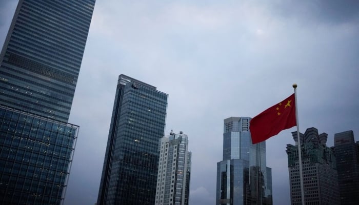 A Chinese national flag is pictured in Shanghai, China, October 14, 2022. — Reuters