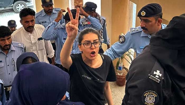 Lawyer and activist Imaan Mazari-Hazir (centre) is pictured before a court in Islamabad on August 20, 2023. — AFP