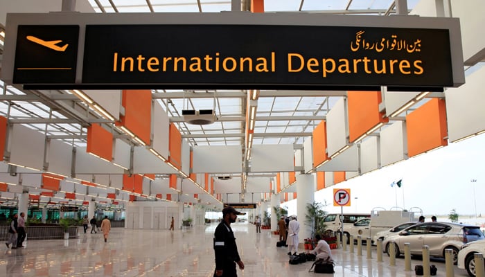 A worker walks at the departure area of the Islamabad International Airport, on April 18, 2018. — Reuters