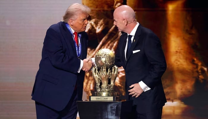 FIFA President Gianni Infantino presents US President Donald Trump with the FIFA Peace Prize during the World Cup 2026 final draw at the Kennedy Centre in Washington, DC, US, on Dec 5, 2025. — Reuters