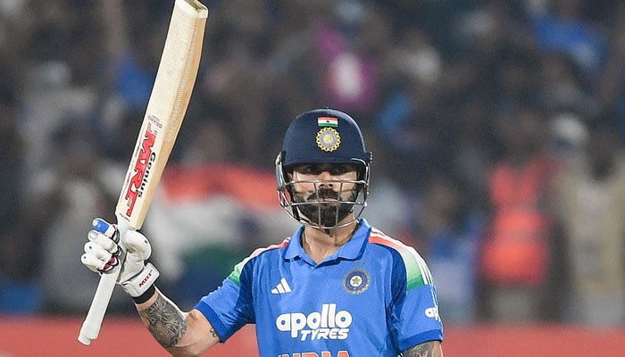 India’s Virat Kohli celebrates after scoring a half-century during the third one-day international (ODI) cricket match between India and South Africa at the YS Rajasekhara Reddy Cricket Stadium in Visakhapatnam on December 6, 2025. — AFP