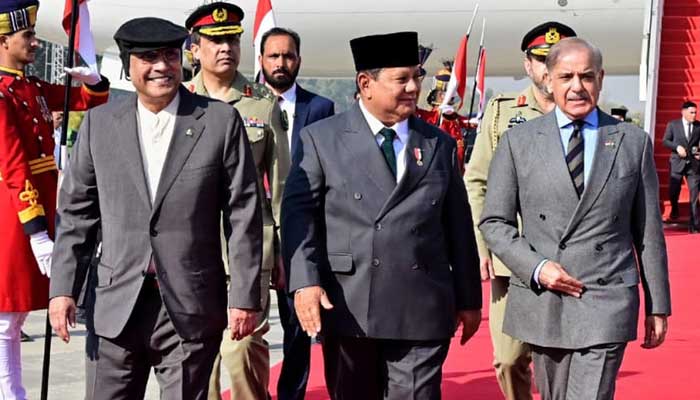 President Asif Ali Zardari and PM Shehbaz Sharif pictured with Indonesia President Prabowo Subianto upon his arrival on official visit at Nur Khan Airbase on December 8, 2025. — PID