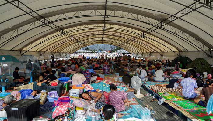 People rest at a shelter, following fresh military clashes between Thailand and Cambodia along parts of their disputed border, in Buriram province, Thailand, December 8, 2025. — Reuters