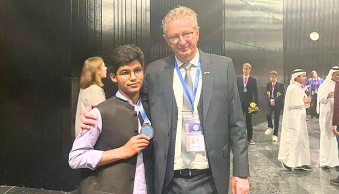 Muhammad Hashir (left), a student from Balochistan Residential College Loralai, poses with ISJO President after bronze medal for Pakistan at ISJO 2025. — Facebook@BRCLOfficial