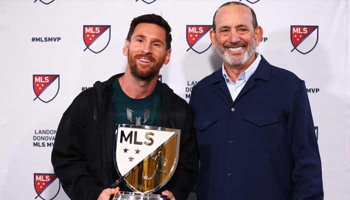 Lionel Messi of Inter Miami CF and MLS Commissioner Don Garber pose for a photo with the 2025 Landon Donovan MLS MVP trophy at Chase Stadium on December 09, 2025 in Fort Lauderdale, Florida. — AFP