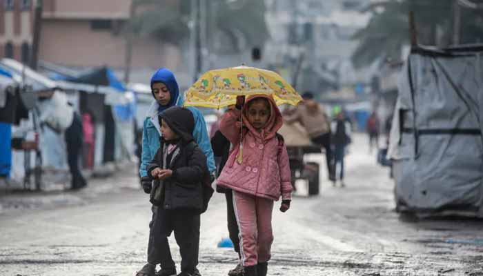 Palestinian children return to school in Deir el-Balah, in the central Gaza Strip, on December 10, 2025. — AFP