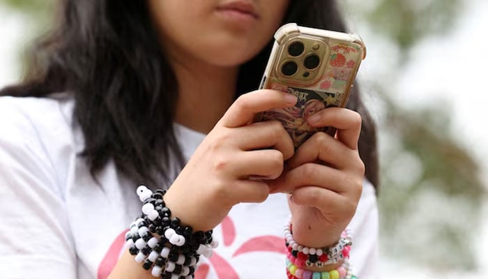 Annie Wang, 14, poses after an interview discussing Australia’s social media ban for users under 16, which is scheduled to take effect on December 10, in Sydney, Australia, November 22, 2025. — Reuters