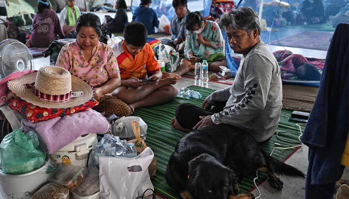 Displaced residents rest as they take shelter at an evacuee center during clashes along the Thai-Cambodia border in Thailand´s Sa Kaeo province on December 10, 2025. — AFP