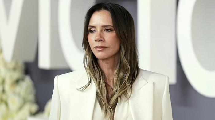 Victoria Beckham's silk midi turns heads as family strain eases