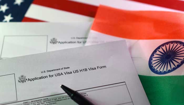US. and Indian flags and H-1B Visa application forms are seen in this illustration taken, September 22, 2025. — Reuters