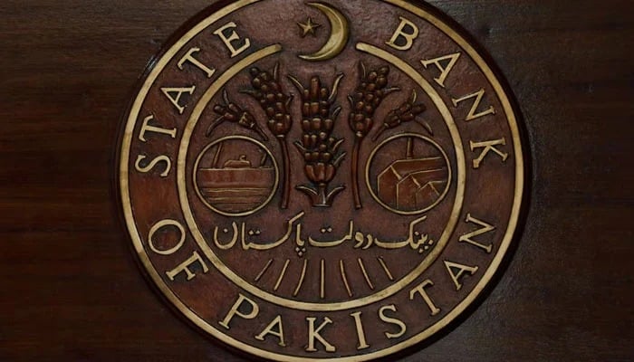 A logo of the State Bank of Pakistan (SBP) is pictured on a reception desk at the head office in Karachi, July 16, 2019. — Reuters