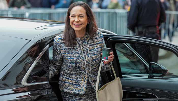 Nobel Peace Prize 2025 laureate Venezuelan opposition leader Maria Corina Machado gets out of a car in front of the Grand Hotel in Oslo, Norway, after an audience at the Royal Palace. — AFP