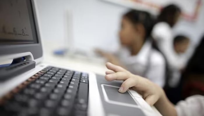 A child uses a laptop in school in this undated photo. — Reuters/ File