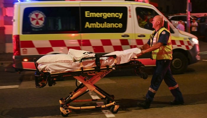 health worker moves a stretcher after a shooting incident at Bondi Beach in Sydney on December 14, 2025. — AFP