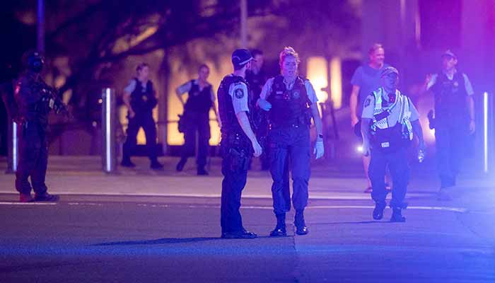 Police officers walk on the street following a shooting incident at Bondi Beach, in Sydney, Australia, December 14, 2025. — Reuters