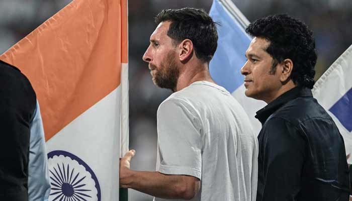 Argentinas footballer Lionel Messi (L) and Indias former cricketer Sachin Tendulkar attend an event during Messis Goat Tour at the Wankhede Stadium in Mumbai on December 14, 2025. — AFP