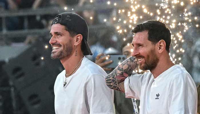 Argentinas footballers Lionel Messi (Right) and Rodrigo De Paul arrive to attend an event during Messi´s GOAT Tour at the Wankhede Stadium in Mumbai on December 14, 2025.— AFP