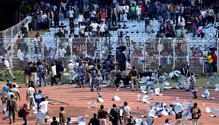 Police and security clash with fans after Argentine soccer star Lionel Messi left the stadium in Vivekananda Yuva Bharati Krirangan, Kolkata, India on December 13, 2025. — Reuters