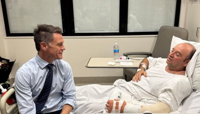 New South Wales Premier Chris Minns visits Ahmed al Ahmed, who hid behind parked cars and seized a rifle from one of the gunmen during the deadly shooting at Bondi, at a hospital in Sydney, Australia, December 15, 2025. — Reuters