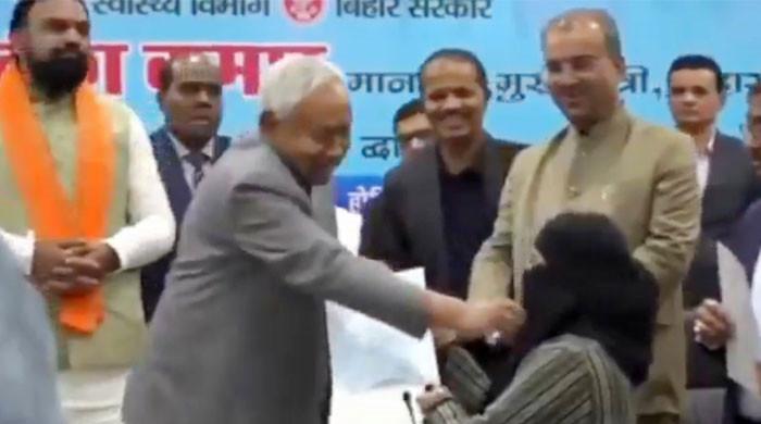 Indian CM pulls down Muslim woman's hijab at official event