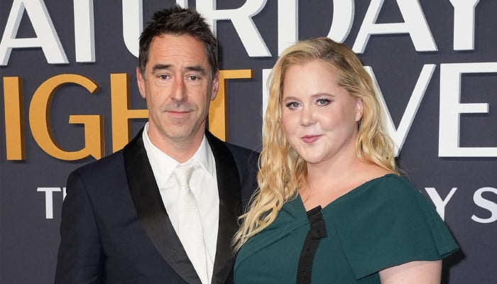Amy Schumer and Chris Fischer living together after divorce
