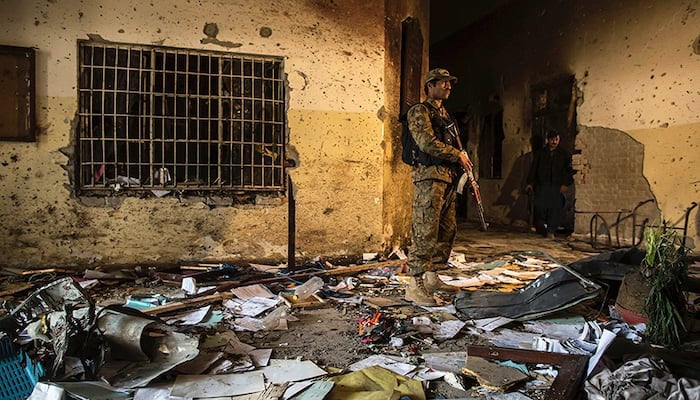 An army soldier stands inside the Army Public School in Peshawar on December 17, 2014. — Reuters