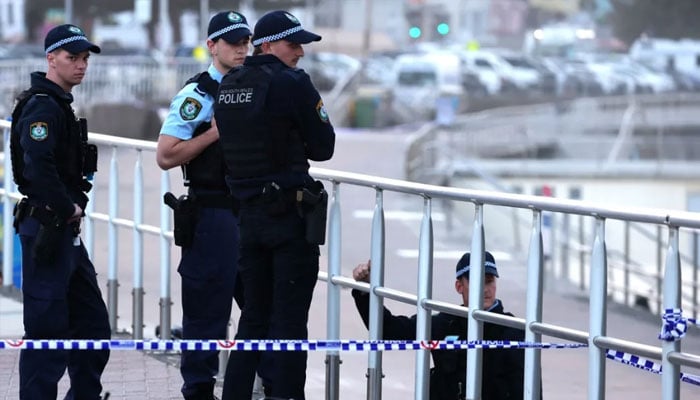 Police patrol Bondi Beach in Sydney on 15 December 2025 as they investigate the scene where two gunmen shot and killed 15 people at a Jewish celebration. — afp