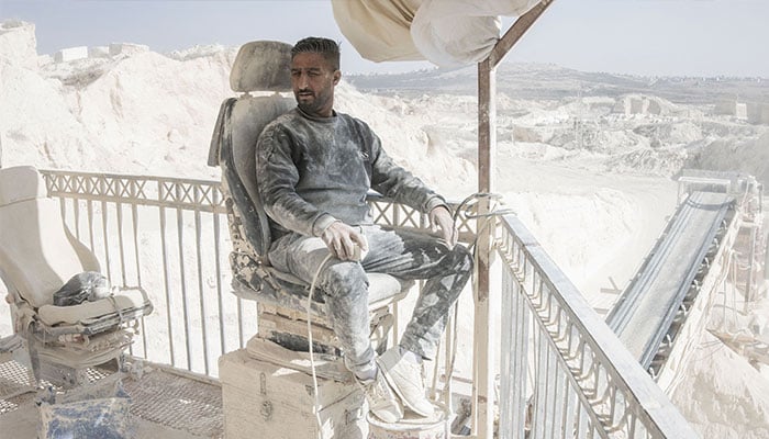 Muhammed sits on a chair as he controls the stone crusher inside a Jerusalem stone quarry in Beit Fajar, eight kilometres south of the Israeli-occupied West Bank city of Bethlehem on November 10, 2025. — AFP