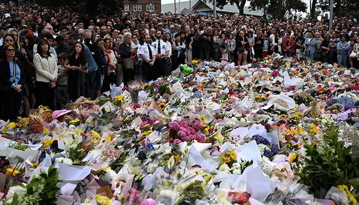 Mourners gather at a tribute at the Bondi Pavilion in memory of the victims of a shooting at Bondi Beach, in Sydney, on December 16, 2025.  — AFP